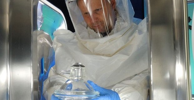 Scientist in hazmat suit